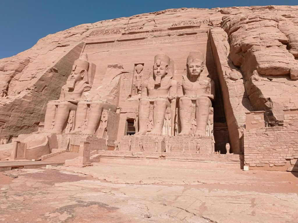 Abu Simbel, an ancient tomb carved on the stone with statues in Egypt