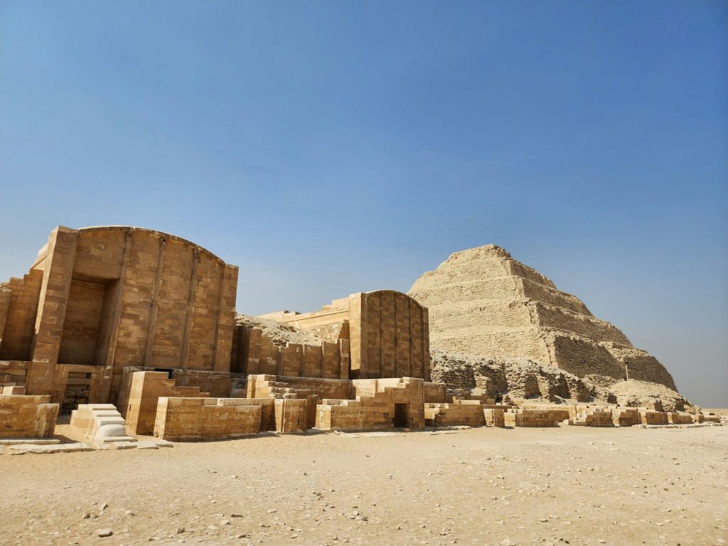 Step pyramids at Saqqara Necropolis in Egypt against the clear blue sky